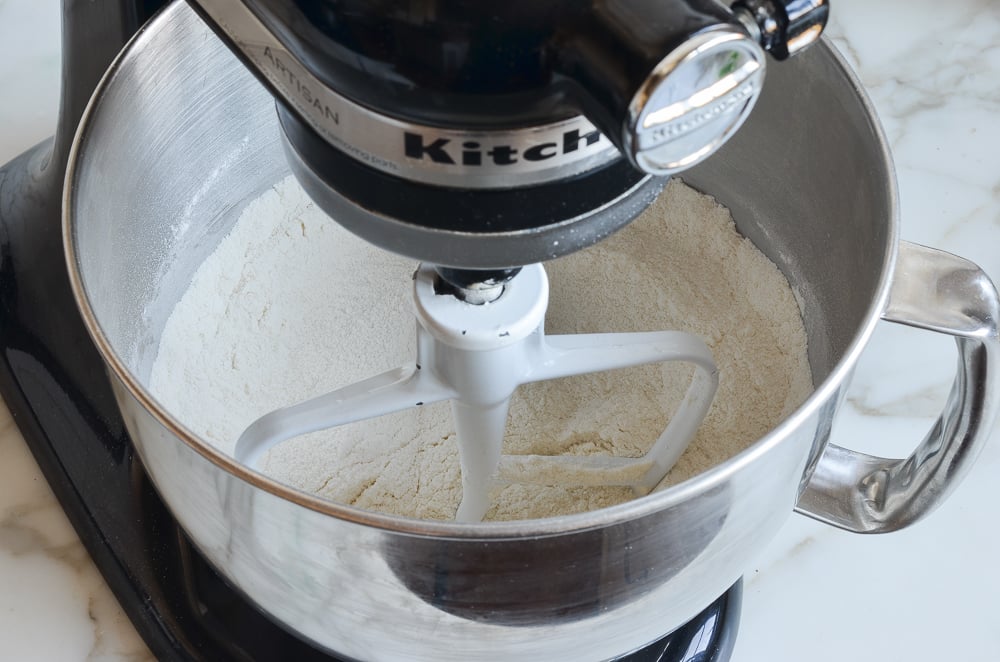 Flour, sugar, baking powder, baking soda, and salt in mixer.