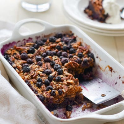 Partially-served dish of blueberry baked oatmeal.