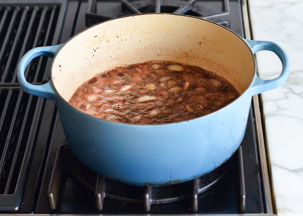 bringing coq au vin liquid to a boil