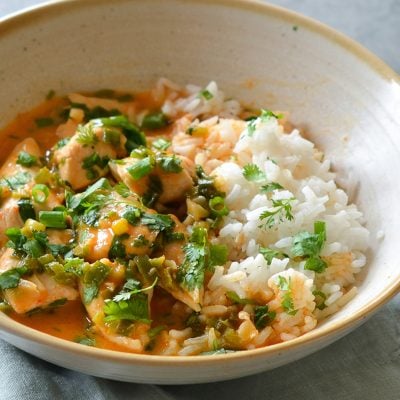 Thai red curry chicken in bowl with jasmine rice