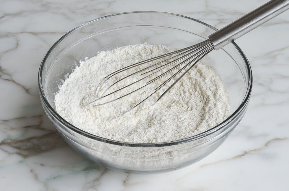 whisking dry ingredients for chocolate chip muffins
