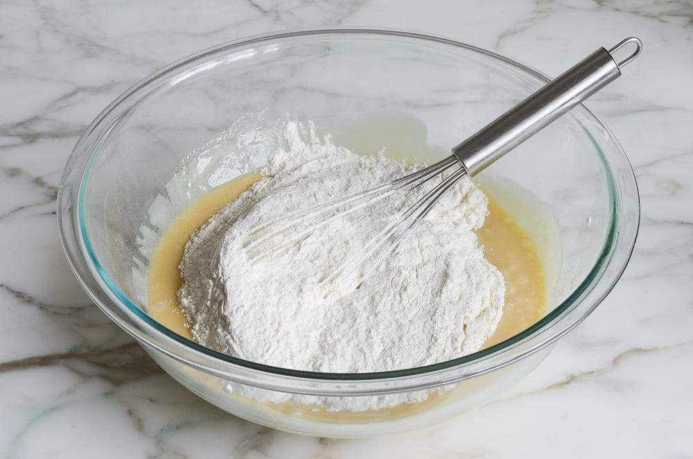 whisking dry ingredients into wet ingredients
