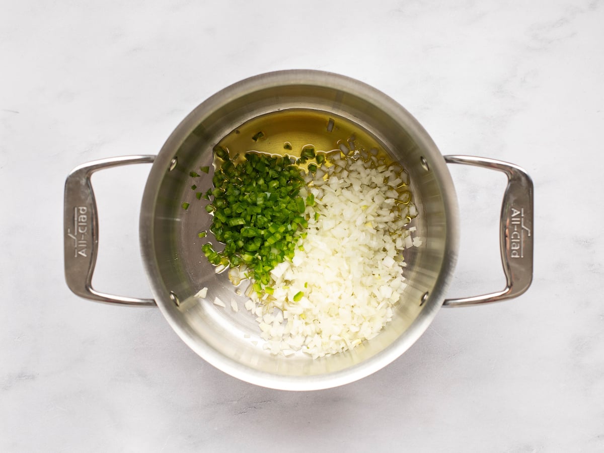 cooking the onion and jalapeno in oil