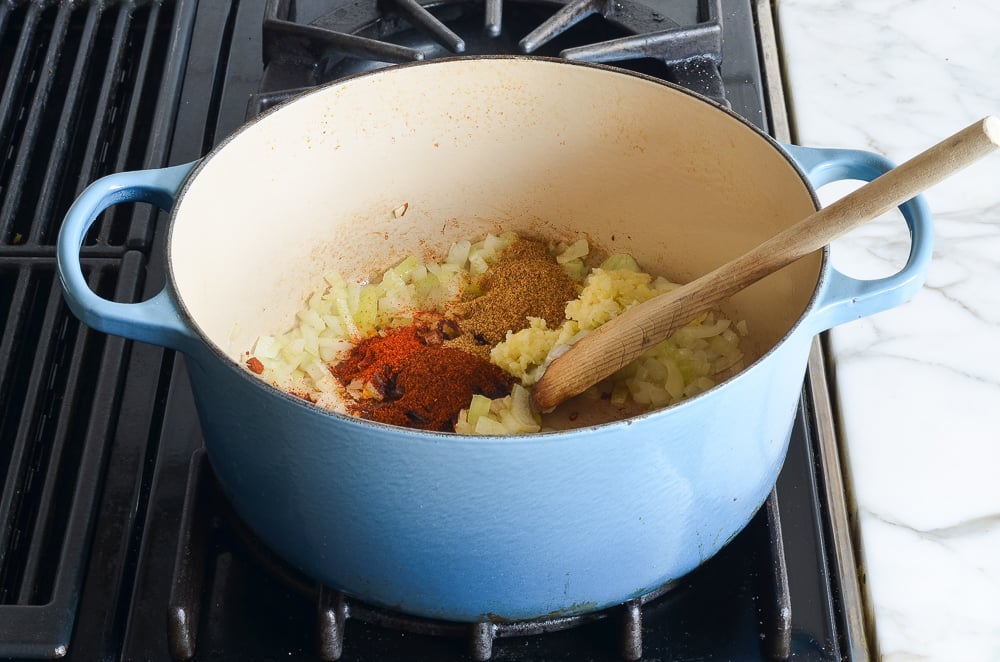adding spices and garlic