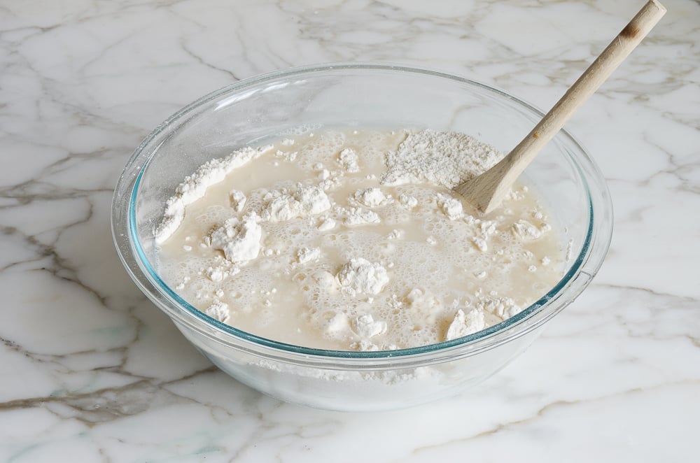 Water in a bowl with dry ingredients.