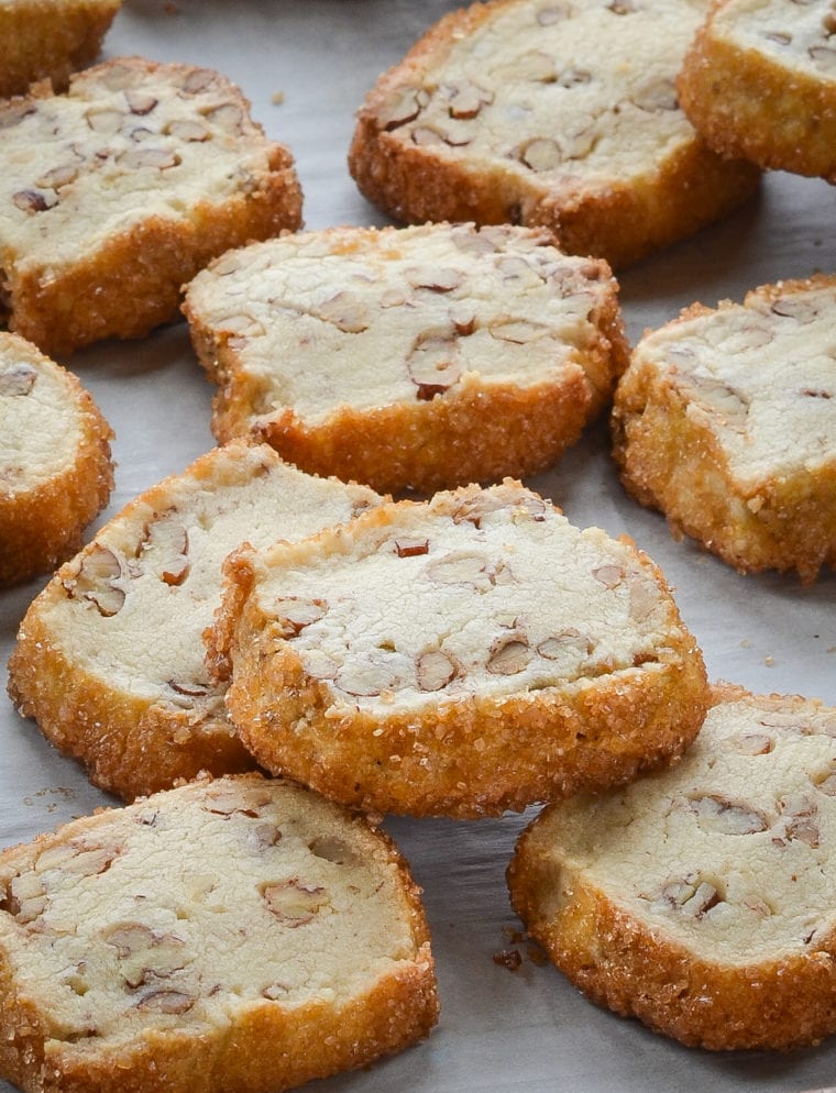 Pecan shortbread cookies on parchment paper.