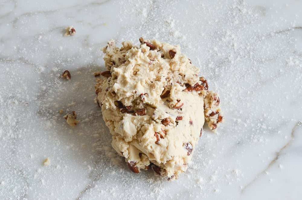 pecan shortbread cookie dough on flour-dusted counter