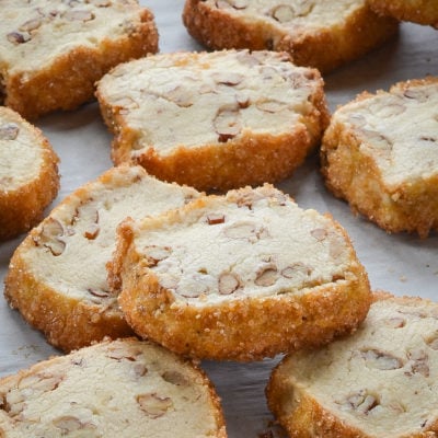 Pecan shortbread cookies on parchment paper.