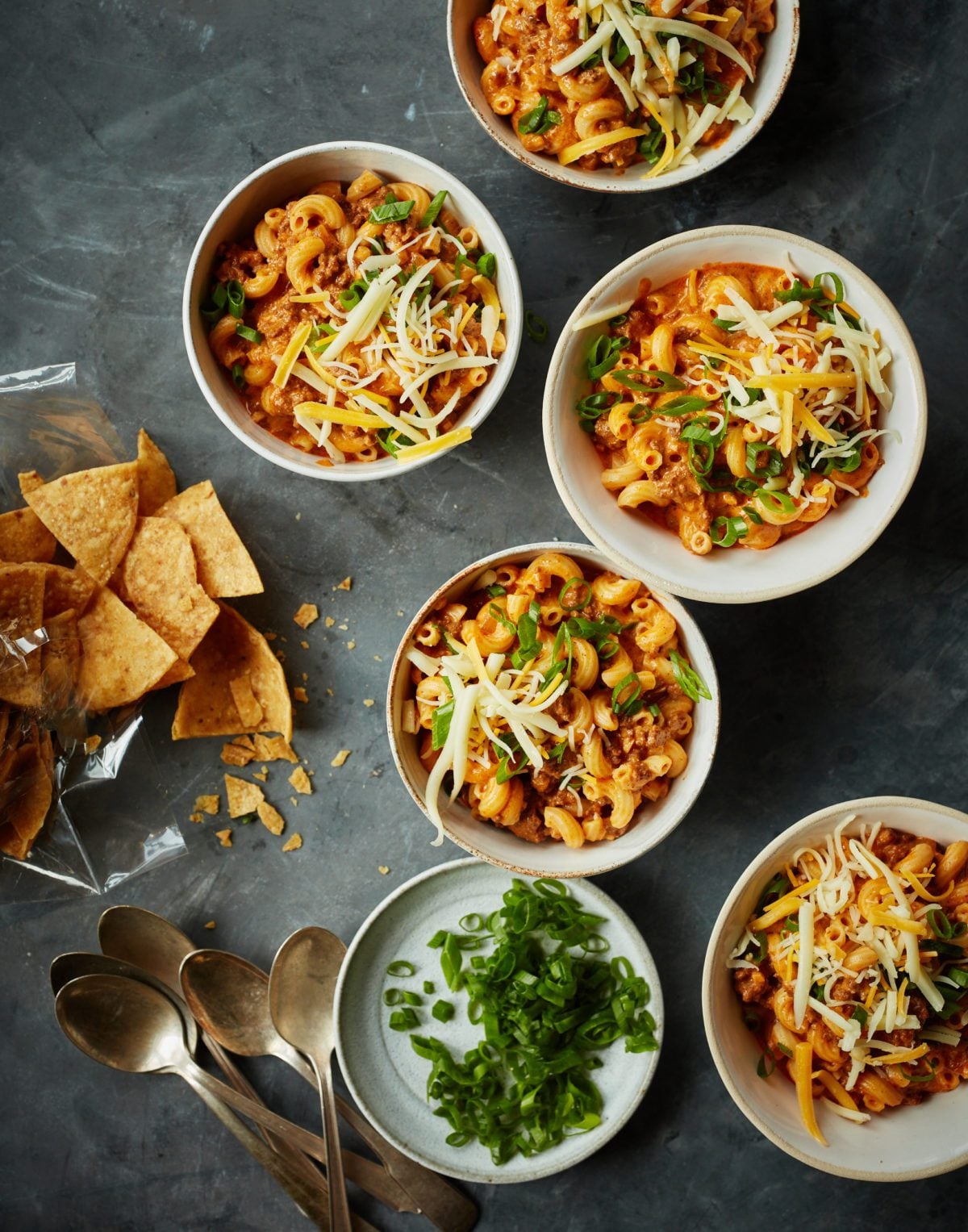 Bowls of chili mac on a table.