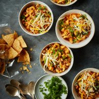 Bowls of chili mac on a table.