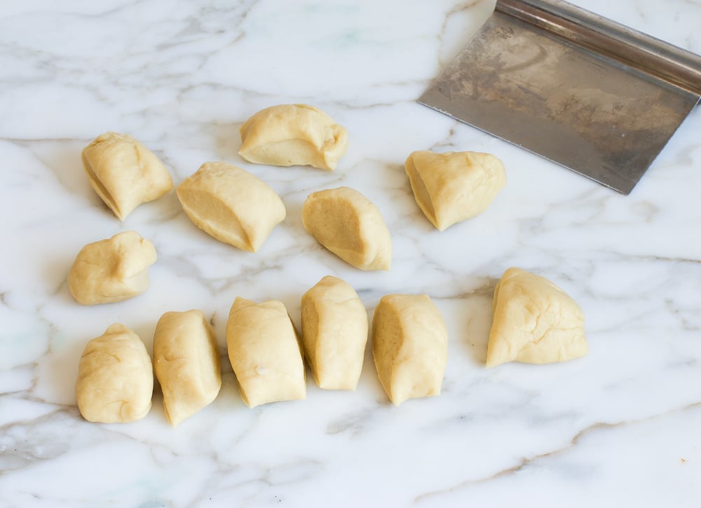 Small balls of dough on a counter.