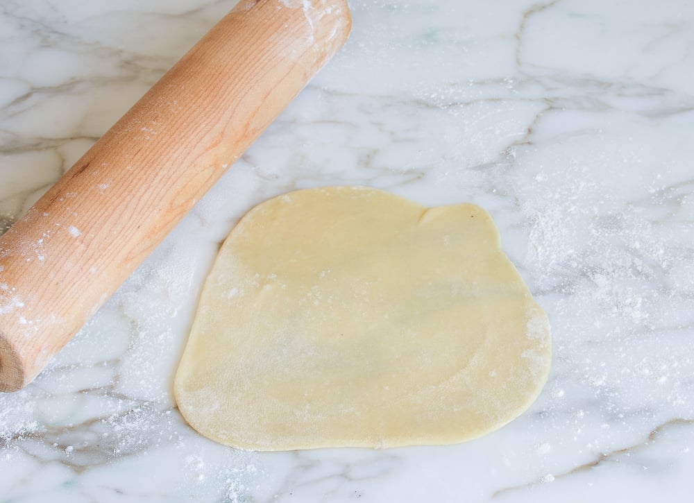 Rolled dough with a rolling pin.