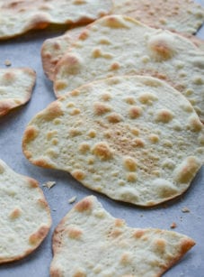 Homemade matzo on parchment paper.