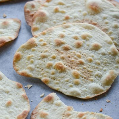 Homemade matzo on parchment paper.