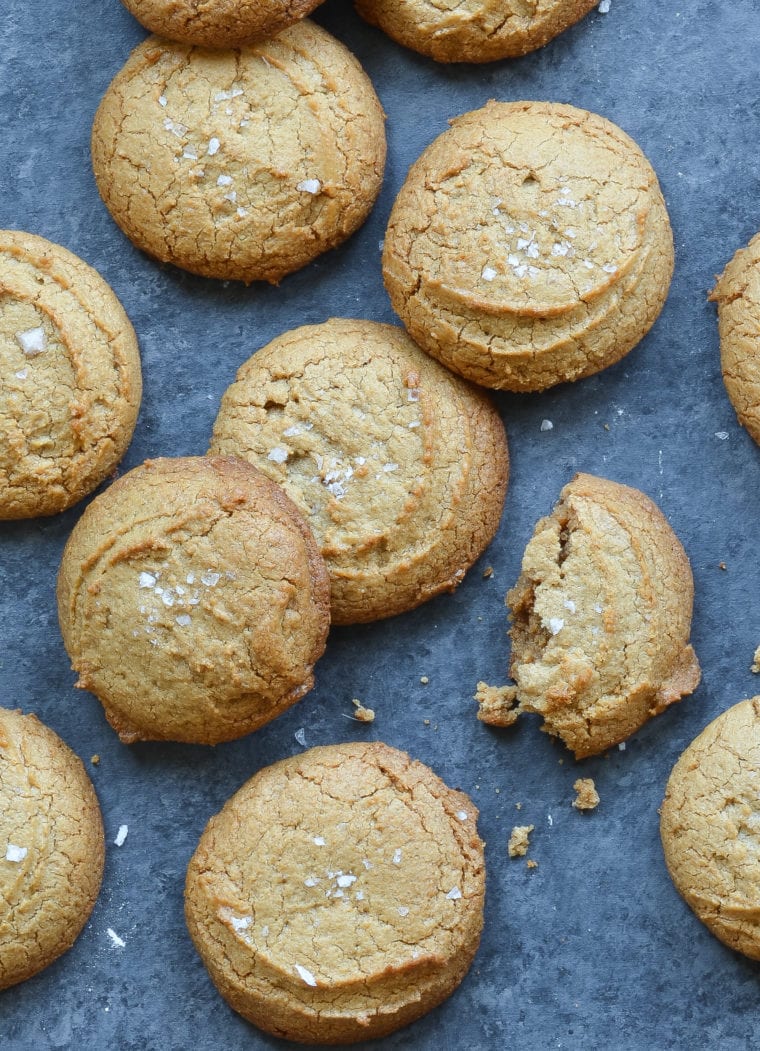 Peanut butter cookies, one of which is broken.