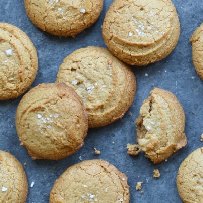 Peanut butter cookies, one of which is broken.