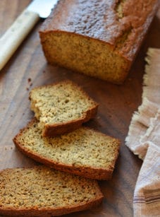 Slices of whole wheat banana bread on a cutting board.