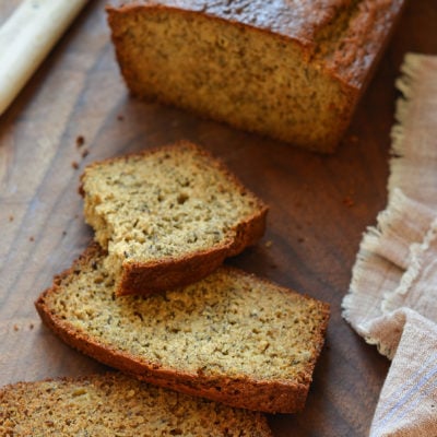 Slices of whole wheat banana bread on a cutting board.