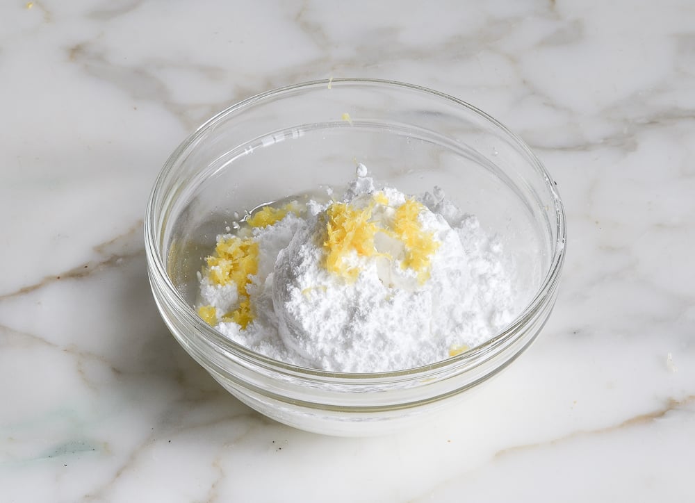 confectioners sugar, lemon zest and lemon juice in bowl for glaze