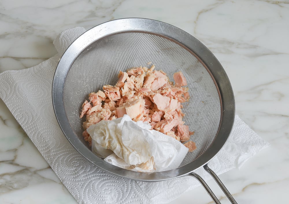 patting the tuna dry