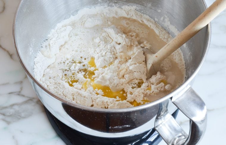 adding the oil and water to the dry ingredients