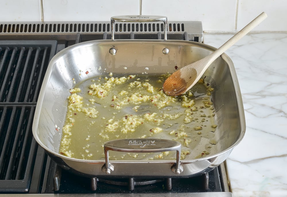 sautéing garlic and red pepper flakes in olive oil