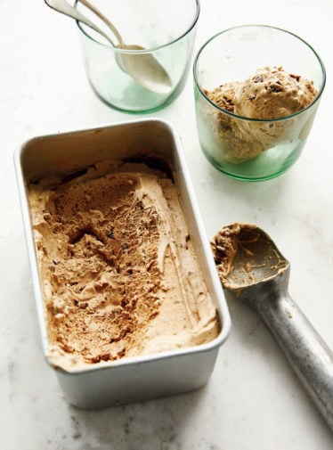 Vietnamese coffee ice cream in a glass and a metal container.