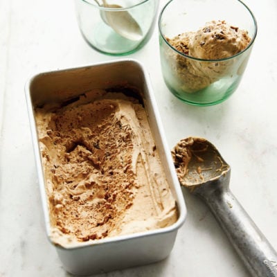 Vietnamese coffee ice cream in a glass and a metal container.