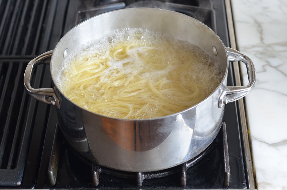 Pot of boiling linguine.