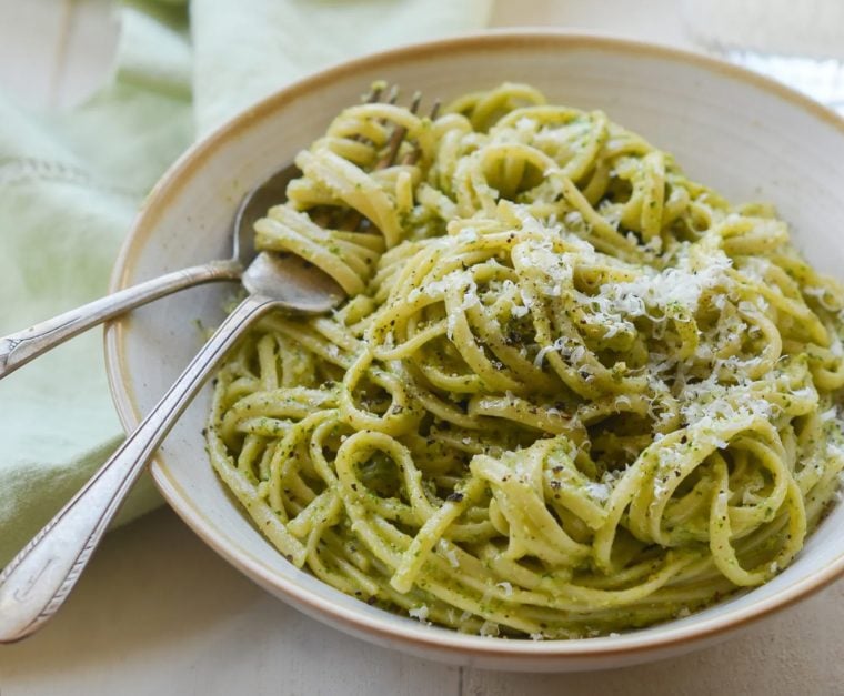 linguine with arugula walnut pesto in bowl