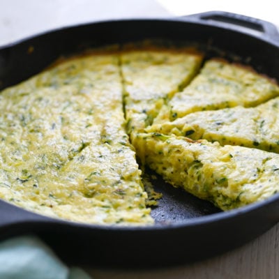 Zucchini frittata in a skillet.