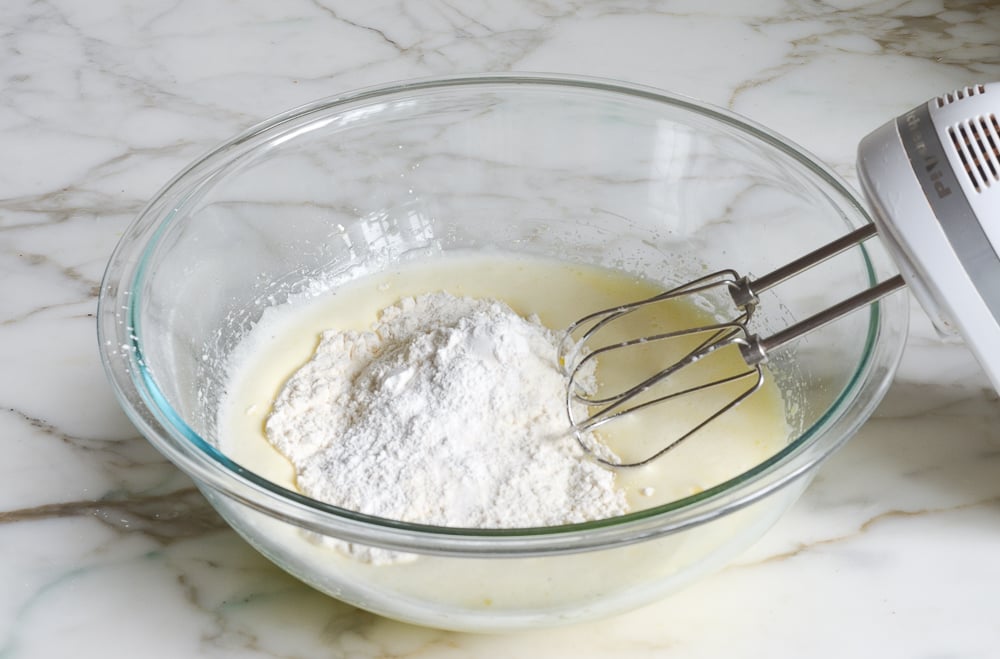 adding dry ingredients to batter