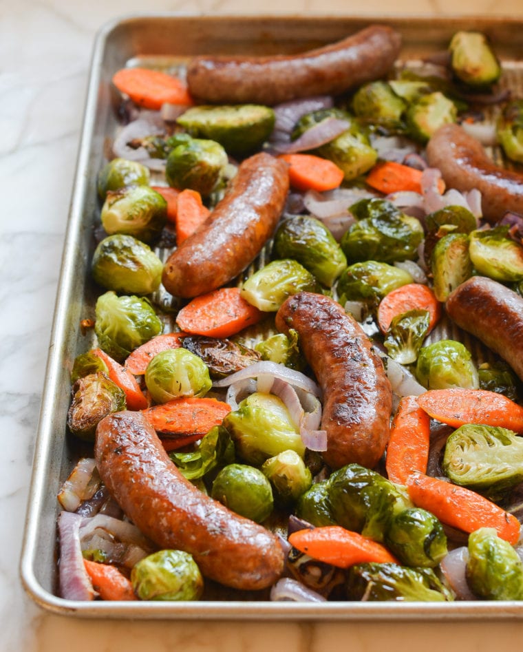 Sheet pan sausage and veggies still on the pan after roasting.