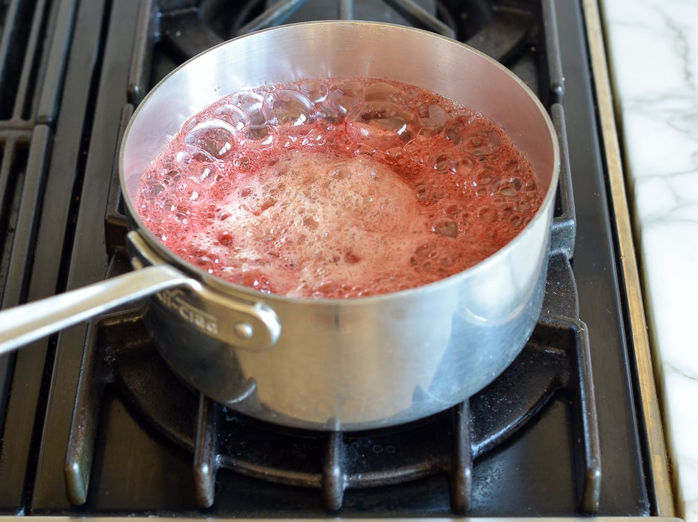 boiling cranberries and maple syrup