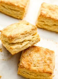 Homemade buttermilk biscuits on baking sheet.