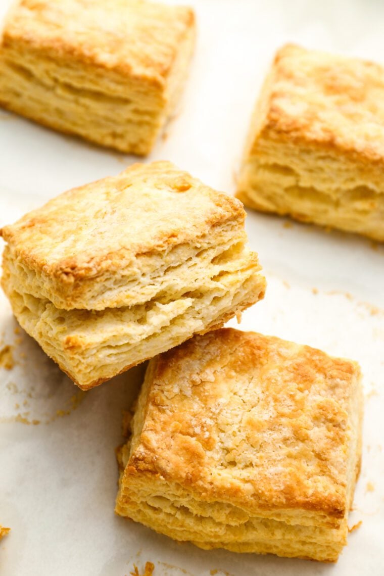 Homemade buttermilk biscuits on baking sheet.