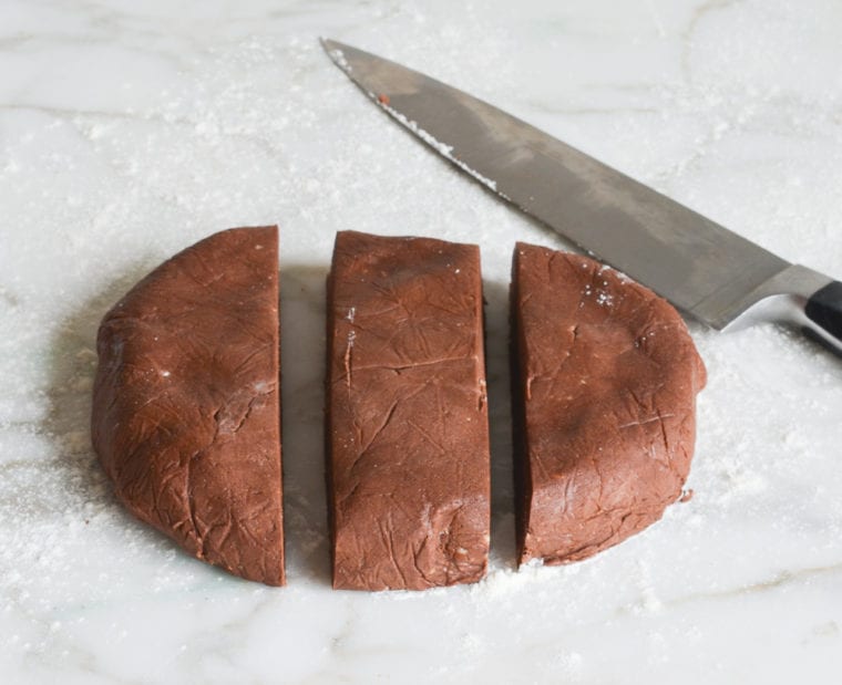 cutting chocolate cookie dough into thirds