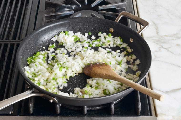 cooking onions, jalapeno, and garlic