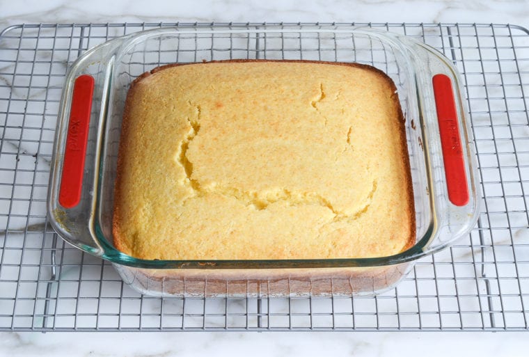 baked cornbread cooling on rack.