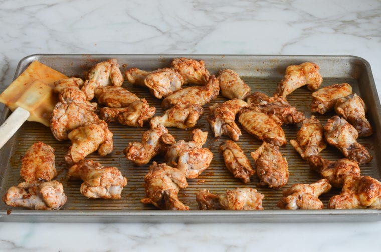 tossed chicken wings ready to bake.
