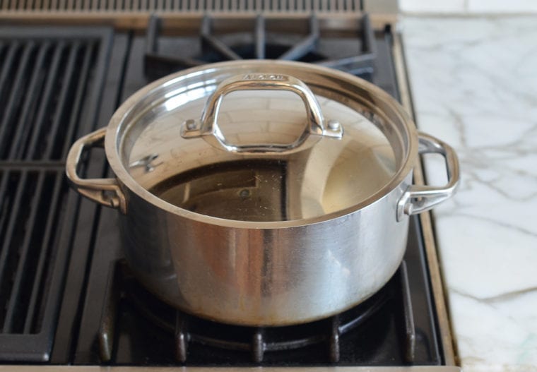 covering the pot with a lid