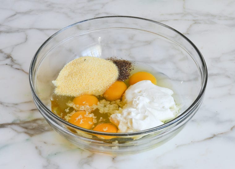 eggs, yogurt, and polenta in mixing bowl