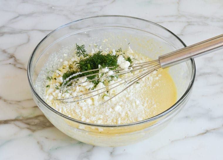 adding cheeses and herbs