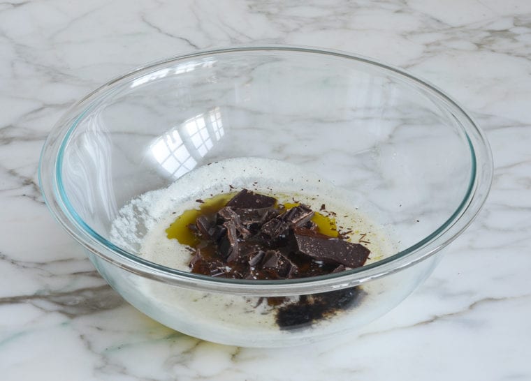 adding chocolate and espresso powder to melted butter