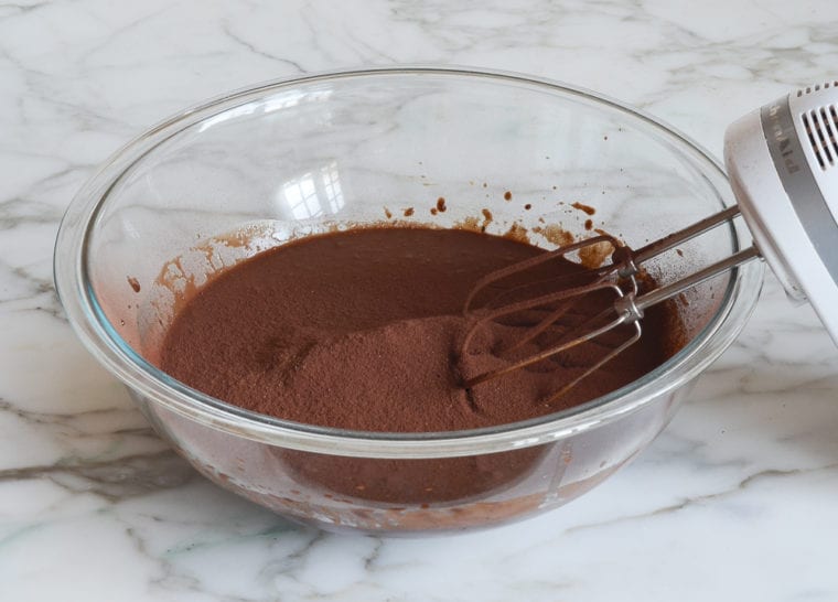 adding the sifted cocoa powder