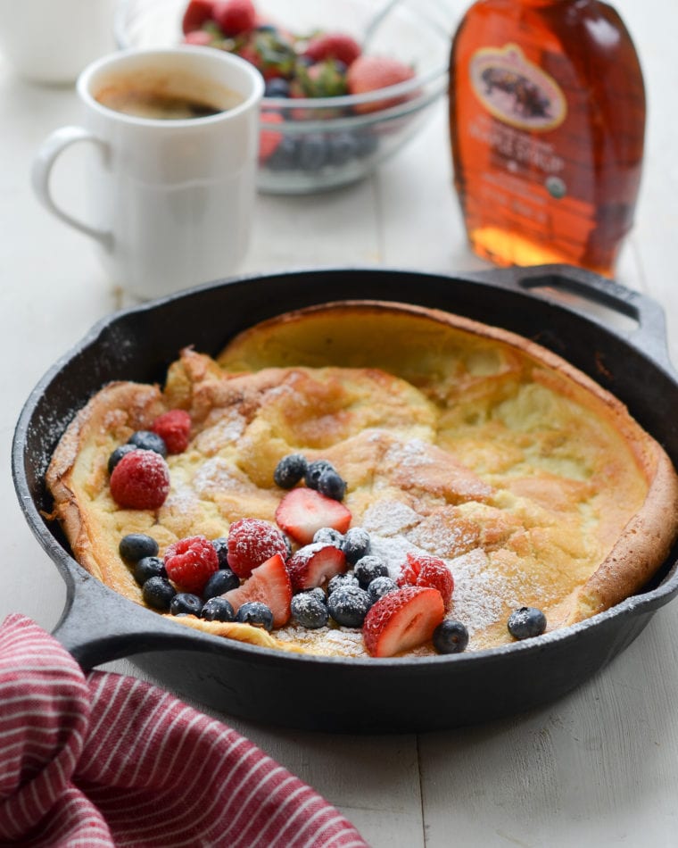 Dutch baby with fruit in a skillet.