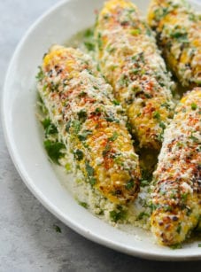 Plate of grilled Mexican street corn (elote.)
