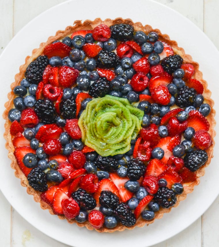 Colorful French fruit tart on a plate.