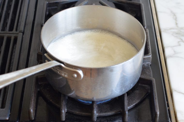 Pot of simmering milk.