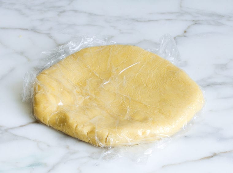 pate sucree dough wrapped in plastic wrap